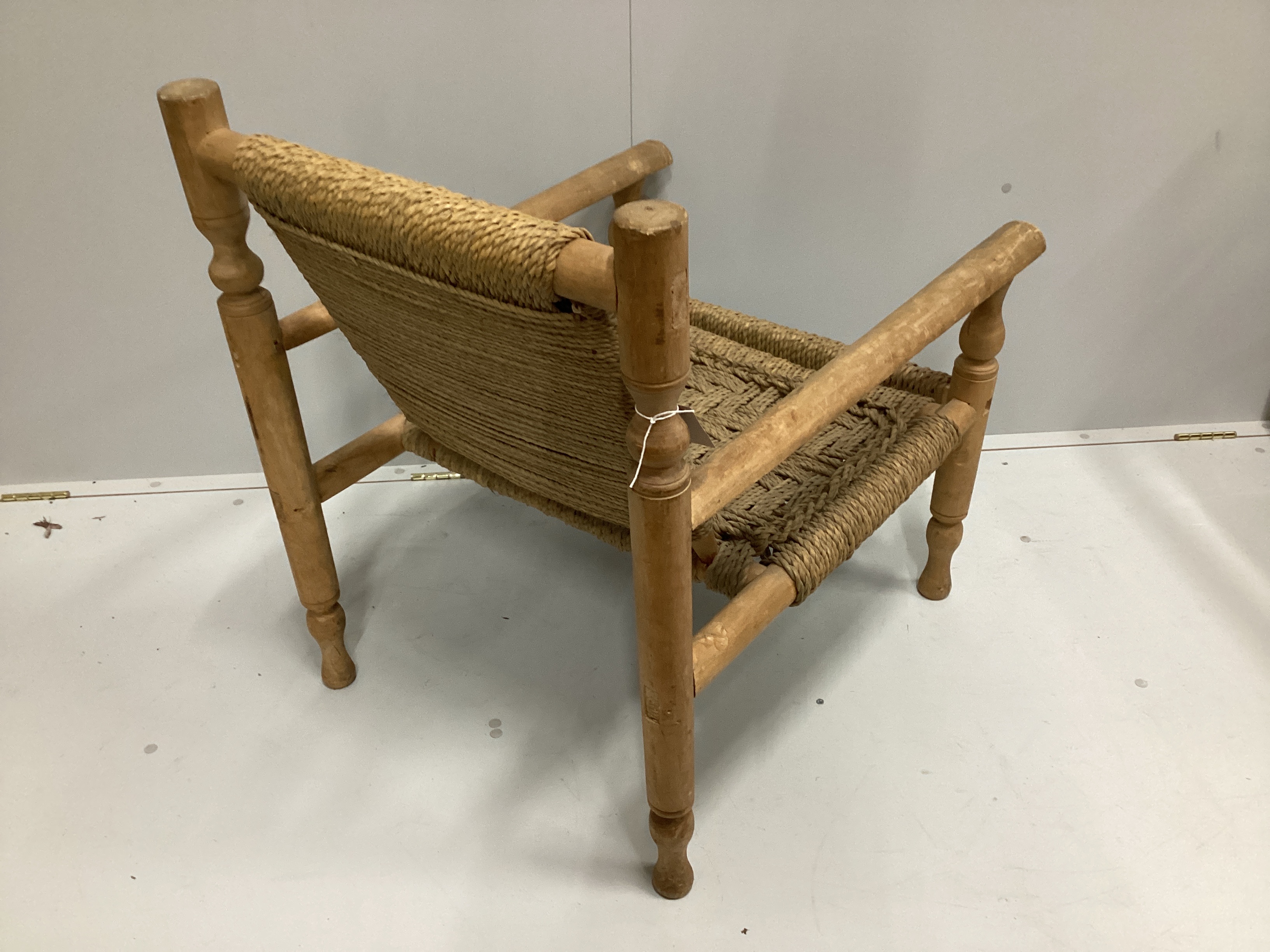 In the manner of Adrien Audoux and Frida Minet a sisal weave beech elbow chair, width 63cm, depth 74cm, height 81cm.